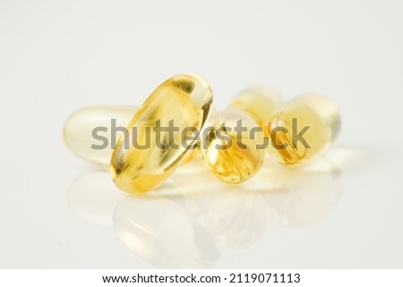 Heap of Omega 3 soft gel capsules                                Royalty-Free Stock Photo #2119071113