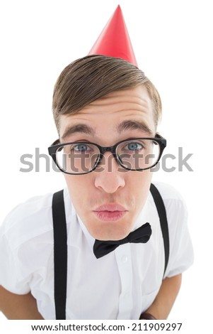 Nerdy hipster looking for a kiss in party hat on white background