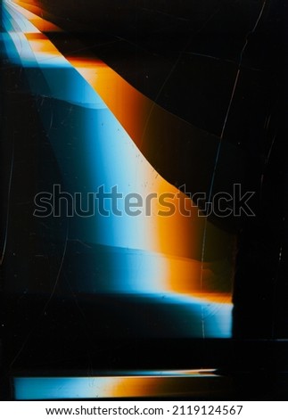 Cracked overlay. Dust scratches texture. Screen matrix noise. Blue orange white glow defect on dark black broken distressed display abstract background.