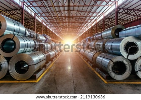 Rolls of galvanized steel sheet inside the factory or warehouse. Royalty-Free Stock Photo #2119130636