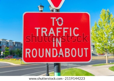 Red roadsign with white To traffic in roundabout at Daybreak in South Jordan, Utah