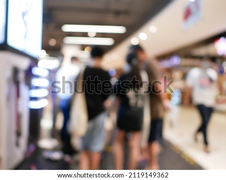 Abstract blur and bokeh in shopping mall in deparment and retails store interior for background