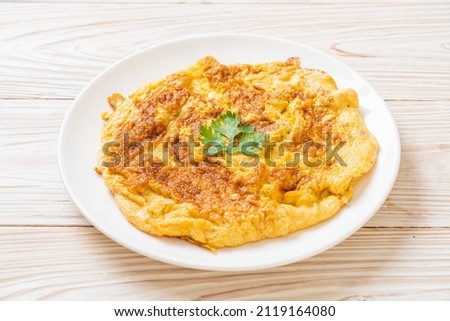 Omelet or Omelette with Ketchup Royalty-Free Stock Photo #2119164080