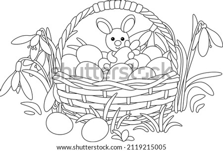 Easter wicker basket with painted eggs and a little toy bunny among spring wildflowers, black and white outline vector cartoon illustration for a coloring book page