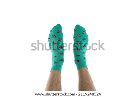 Male legs in funny socks isolated on white background