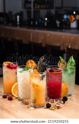 Five colorful gin tonic cocktails on bar counter in pup Royalty-Free Stock Photo #2119250255