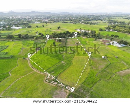 Land plot in aerial view, Top view land green field agriculture plant with pins, pin location icon for housing subdivision residential development owned sale rent buy or investment countryside suburbs Royalty-Free Stock Photo #2119284422
