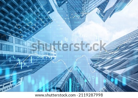 Creative glowing big data forex candlestick chart on blurry city background. Trade, technology, investment and analysis concept. Double exposure