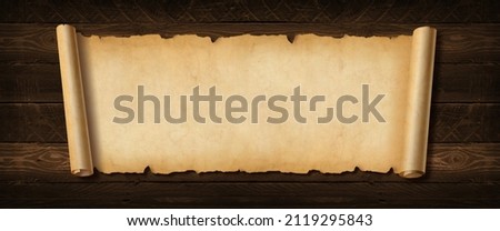 Old paper horizontal banner. Parchment scroll on a wood board background