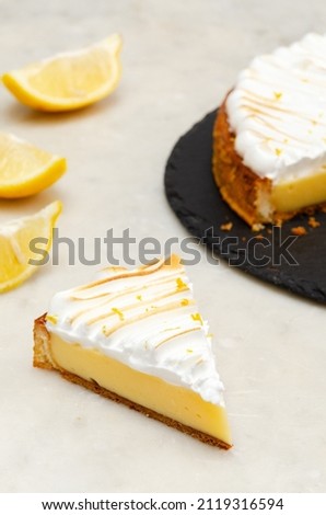 Classic Lemon Custard Tarte on white background. Lemon meringue pie. Tarte au citron.