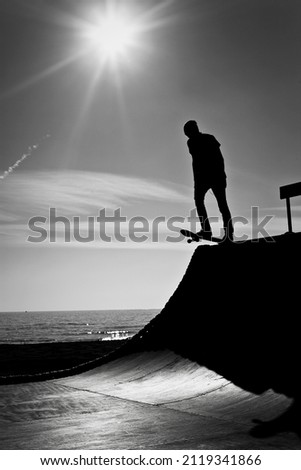 Skateboarding in front of the sea