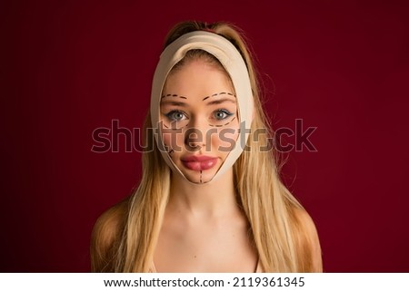 Luxurious woman and plastic surgery moment. Exaggerated injection to the lips of a beautiful blonde Royalty-Free Stock Photo #2119361345