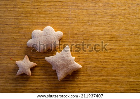 Gingerbread cookies on wooden background 