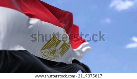 Detail of the national flag of Egypt waving in the wind on a clear day. Democracy and politics. Patriotism. Northeastern african country . Selective focus.