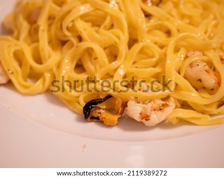 hand made italian pasta called tagliolini with  muscles and shrimpss