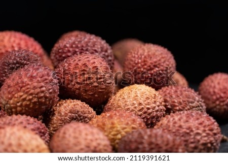 Fresh lychee fruits on the stone plate. Lychee background