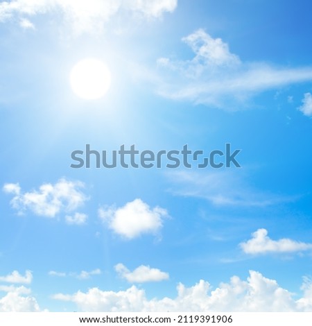 Blue sky , sun and beautiful natural white clouds.