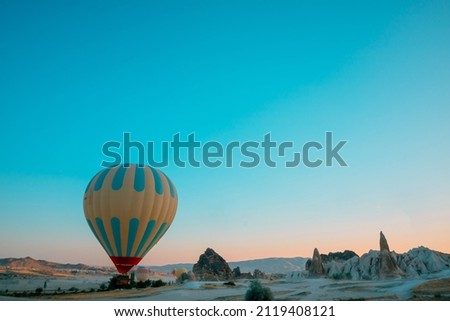 Hot air balloon. Treval to Goreme background photo. Ballooning activities in Cappadocia. Selective focus. Noise included.