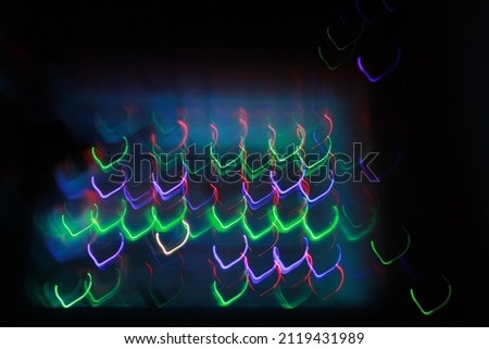 Multi-colored bright abstraction of lights for mood in a dark room. Artistic blur.