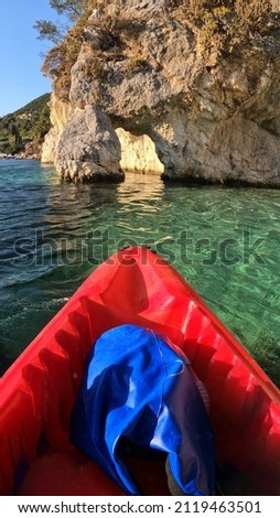 Underwater split photo of red kayak in tropical exotic island bay with emerald calm sea