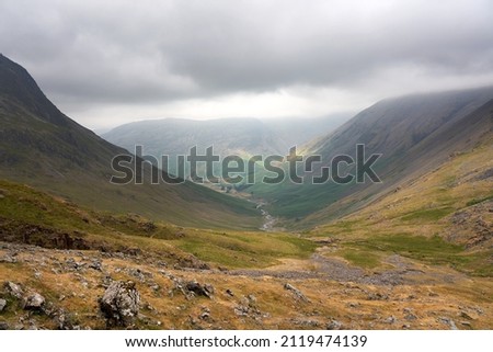 Distant views of Wasdale Head valley, Yewbarrow and Kirk Fell from Sty Head in the English Lake District, UK. Royalty-Free Stock Photo #2119474139