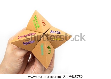 Female hands holding blank paper fortune teller game isolated on white background.