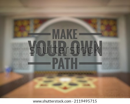 Make Your Own Path quote on a blur background. Motivational concept