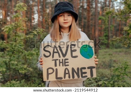 demonstration against global warming and pollution. Child boy making protest about climate change, plastic problems, global warming, pollution. Save the planet poster. Climate Strike. Eco Activism Royalty-Free Stock Photo #2119544912