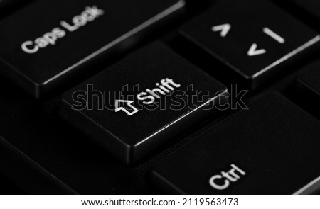 Shift key button on black background and texture 