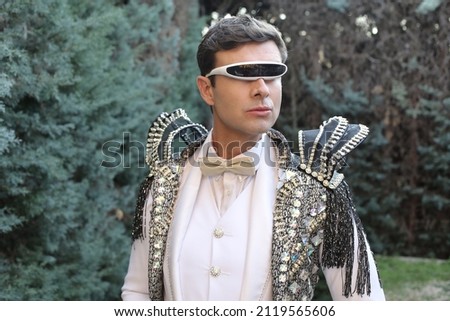 Eccentric man wearing extravagant clothing Royalty-Free Stock Photo #2119565606