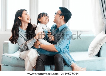 asian family pictures at home Royalty-Free Stock Photo #2119575044