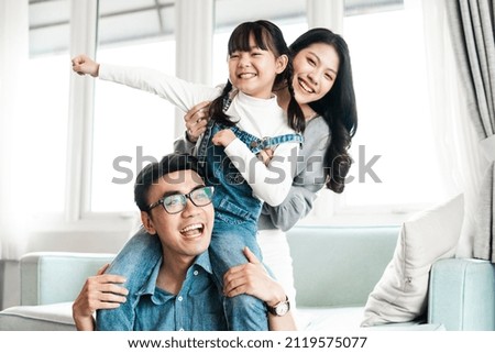 asian family pictures at home Royalty-Free Stock Photo #2119575077
