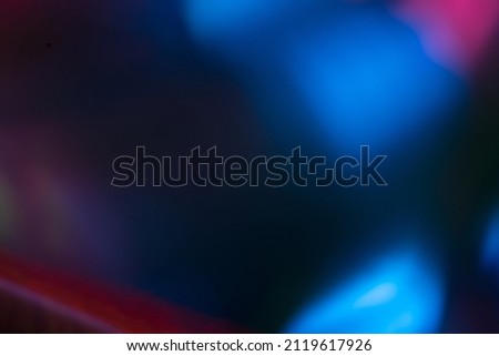 Color lens flare. Futuristic background. Blur fluorescent uv led illumination. Defocused neon blue pink light on dark abstract overlay. Royalty-Free Stock Photo #2119617926