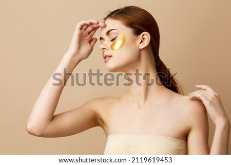 pretty woman gesturing with his hands skin care beige background