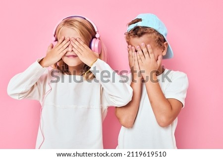 a boy in a cap and a girl are playing together isolated background