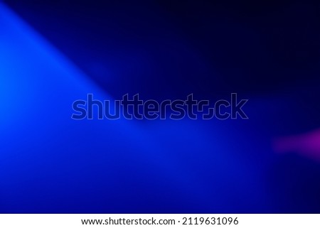 Neon light background. Blur color glow. Fluorescent radiance. Defocused bright blue soft glare leak on dark black abstract texture overlay filter.
