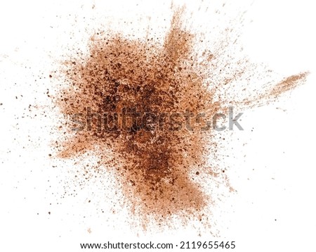Cocoa powder explosion on white background Royalty-Free Stock Photo #2119655465