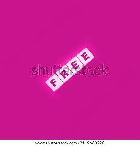 the word free on wooden blocks on black background. Business concept.