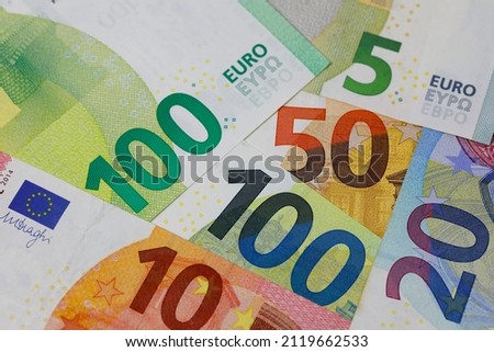 There are European Union banknotes placed next to each other. Euro banknotes are not made of paper, but of pure cotton fiber to improve their durability. EUR currency.
