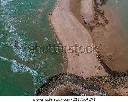 drone shot aerial view top angle seascape photo of Dhanuskodi end point of india tamilnadu tourism turquoise blue ocean water lonely road ending at sea waves islands Beach sand gravel rocks 