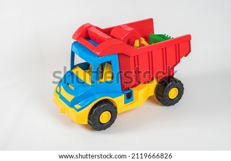 Truck. Plastic toy multicolored cars isolated on white background.