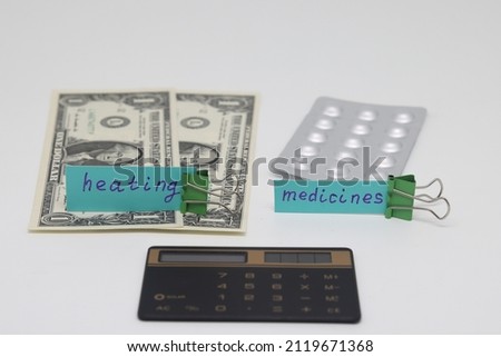 Dollar bills inserted into the radiator slots of the heating system, the increase in the cost of heat, fuel crisis, utility bills