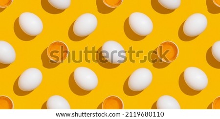Chicken eggs pattern. Festive Easter background from eggs. Royalty-Free Stock Photo #2119680110