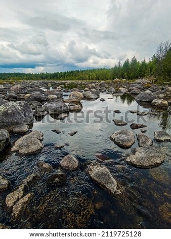 river and rocks sky and clouds, beautiful photo digital picture , picture taken in Sweden, Europe , Digital created image Picture