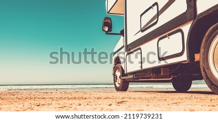 Modern Class C Motorhome Camper Van RV on a Sandy Pismo Beach in California. Summer Vacation Road Trip.  Royalty-Free Stock Photo #2119739231