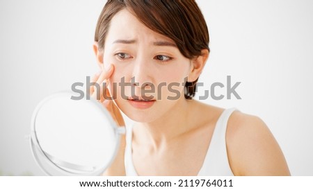 Beauty Image of young woman taking care of her skin Royalty-Free Stock Photo #2119764011