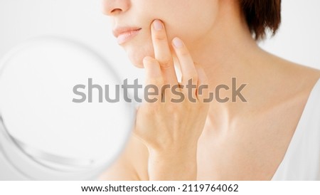 Beauty Image of young woman taking care of her skin Royalty-Free Stock Photo #2119764062