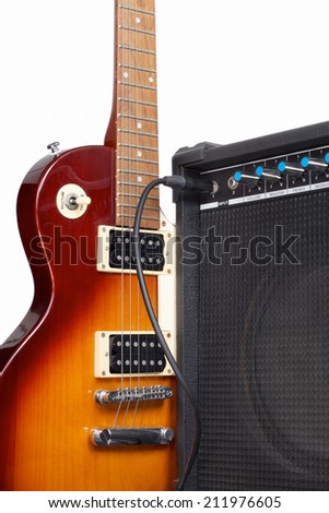Amplifier and Guitar on White