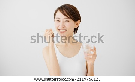 A young woman taking care of her oral health.