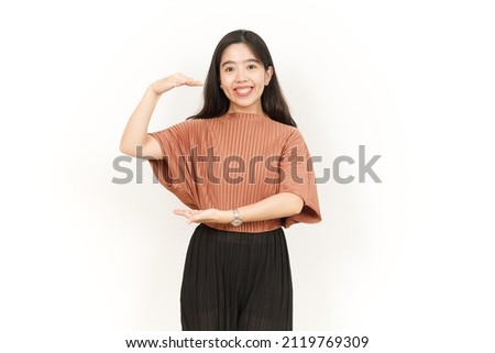 Measuring and Showing Big Sign Product Of Beautiful Asian Woman Isolated On White Background